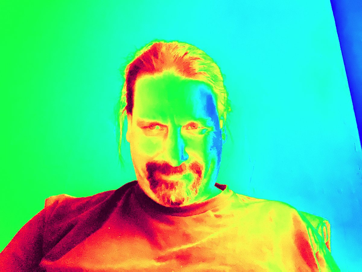 John A. D. Cunningham in a rainbow thermal-style color portrait
