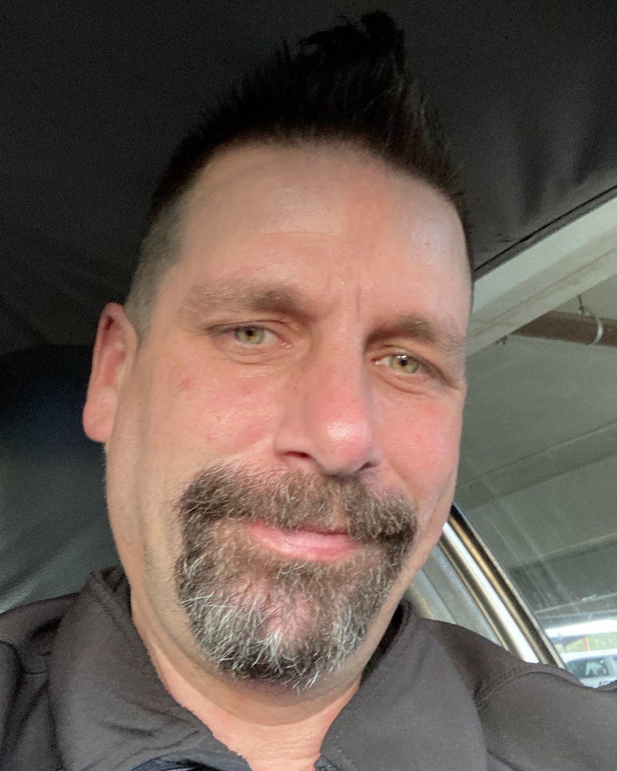 John A. D. Cunningham, founder of Music and Healing Arts, smiling in a close-up selfie